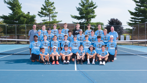 2021 Lansing Catholic High School Boys Tennis Team in their blue uniforms. 